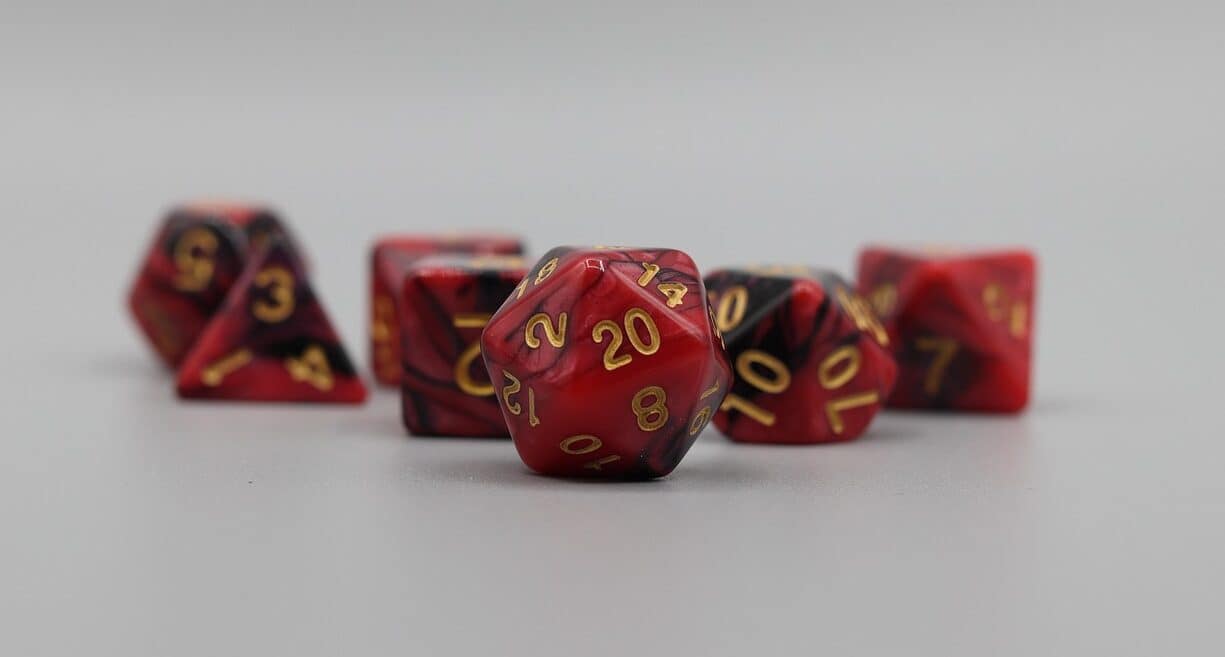 Five red dice on a white background
