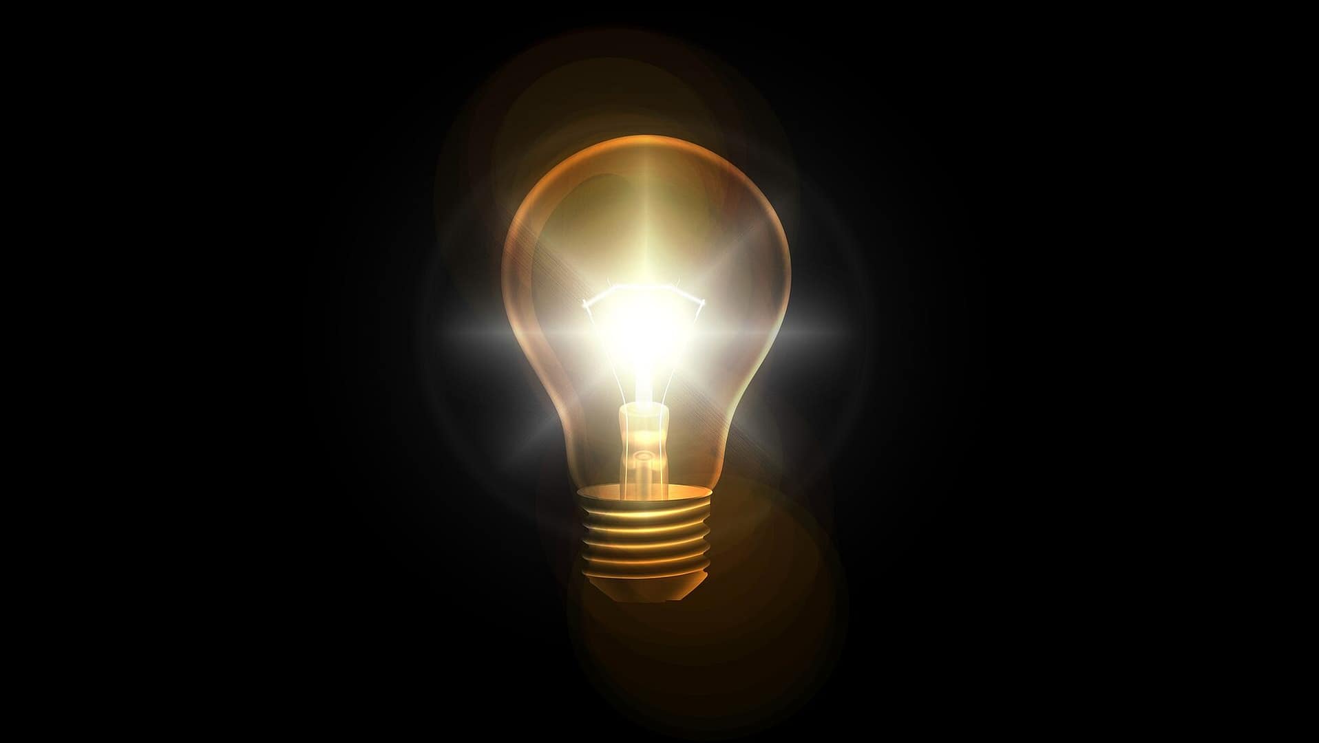 A light light bulb against a dark background