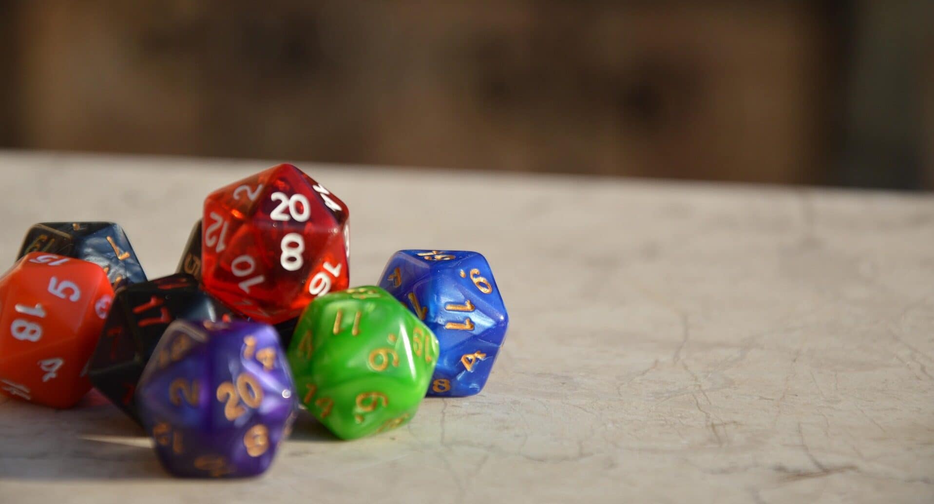 A pile of many-sided dice of various colours
